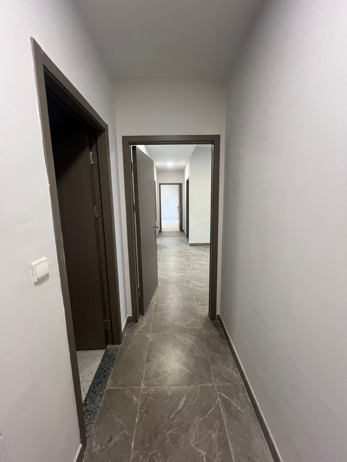 Al-Hawiyah — Apartment corridor · Flooring & doors