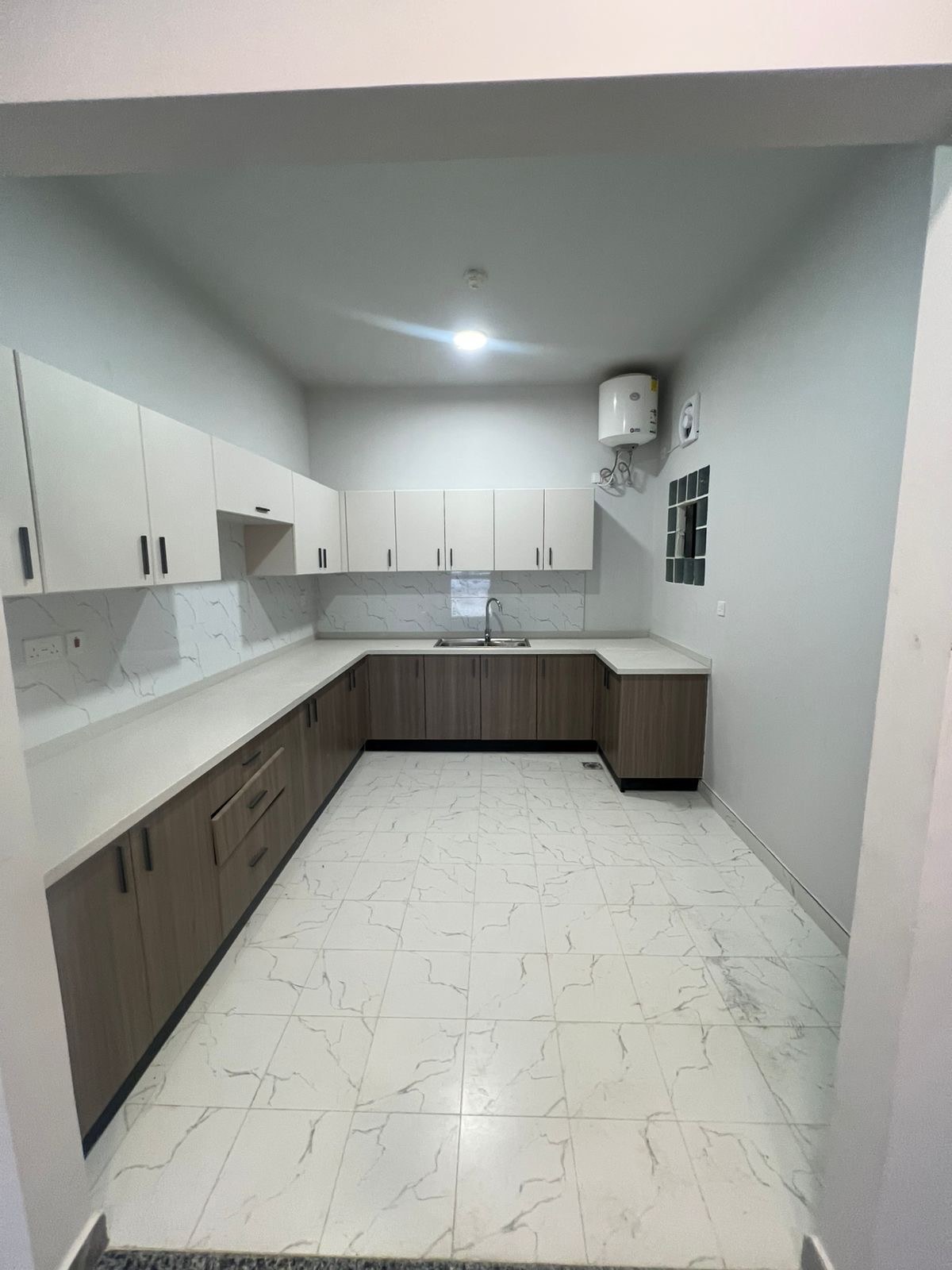 Al-Hawiyah — Kitchen · Cabinetry & finishes