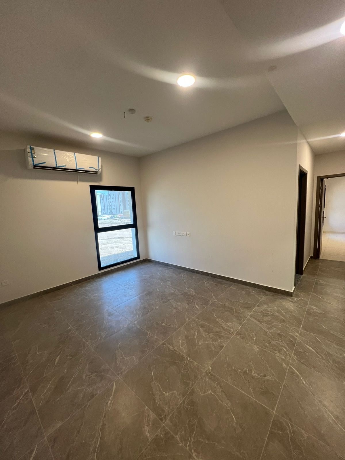 Al-Hawiyah — Living area · Flooring & lighting