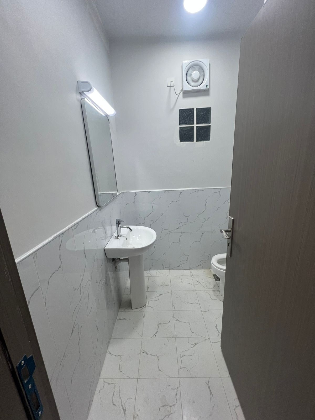 Al-Hawiyah — Bathroom · Basin & wall tiling